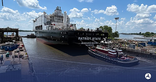 Large ship named Patriot State at Philly Shipyard with tugboats nearby.