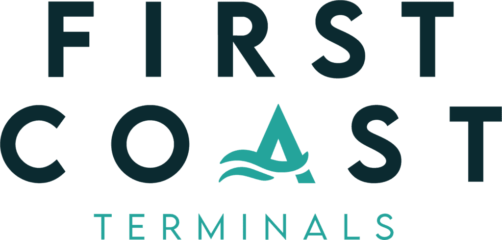 A person using a terminal at an airport check-in counter.