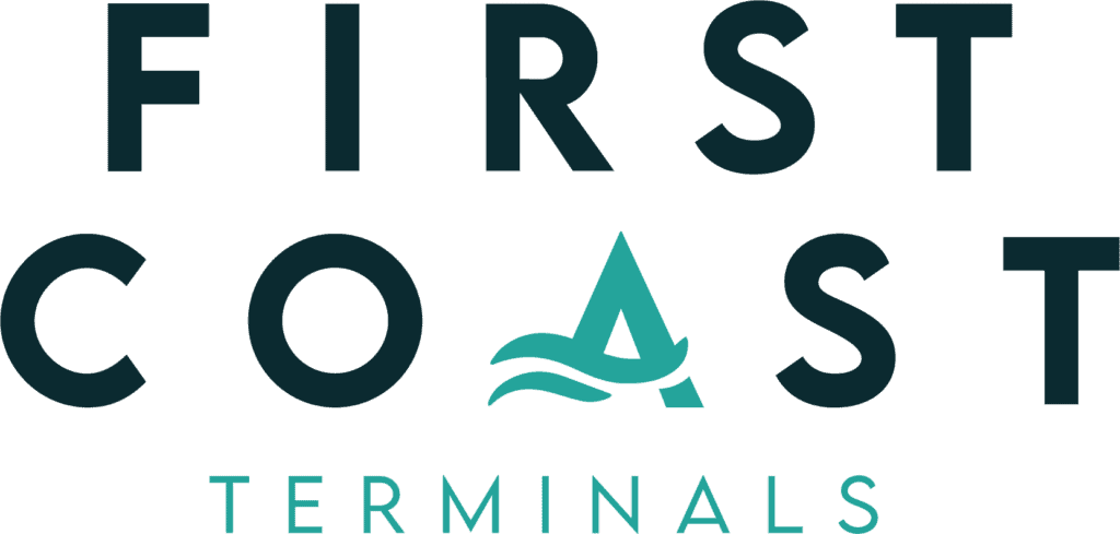 A person using a terminal at an airport check-in counter.