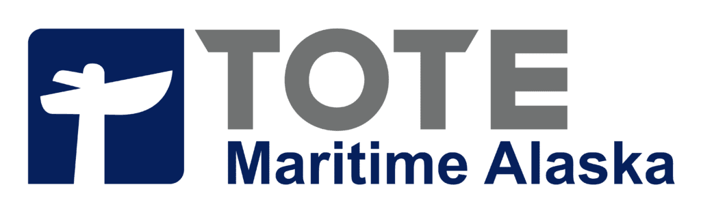 A boat sailing on calm waters with a clear sky in the background.