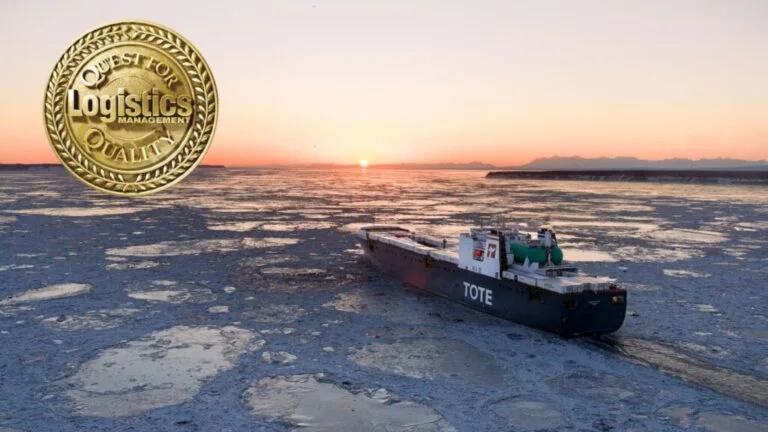 TOTE Maritime Alaska ship navigating icy waters at sunset.