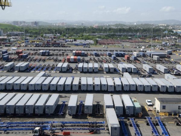 Aerial view of a large truck parking lot with numerous trailers and containers.